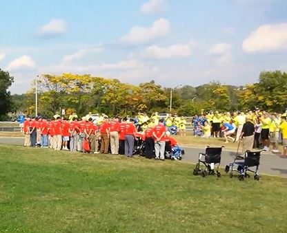 (Syracuse Honor Flight Veterans pose for photo at Iwo Jima Monument, Oct. 5, 2013, after moving barricades)