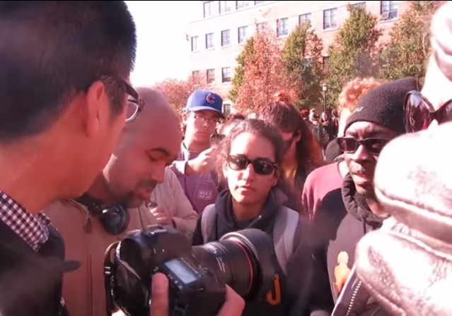 [U. Missouri Protesters confront student journalist]